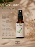 Hand sanitizer bottle with 'Essence of Healing' branding on a natural background. Made with Aloe Vera.
