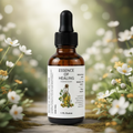Bottle of 'Essence of Healing' Eczema Elixir botanical Oil with a natural background of flowers